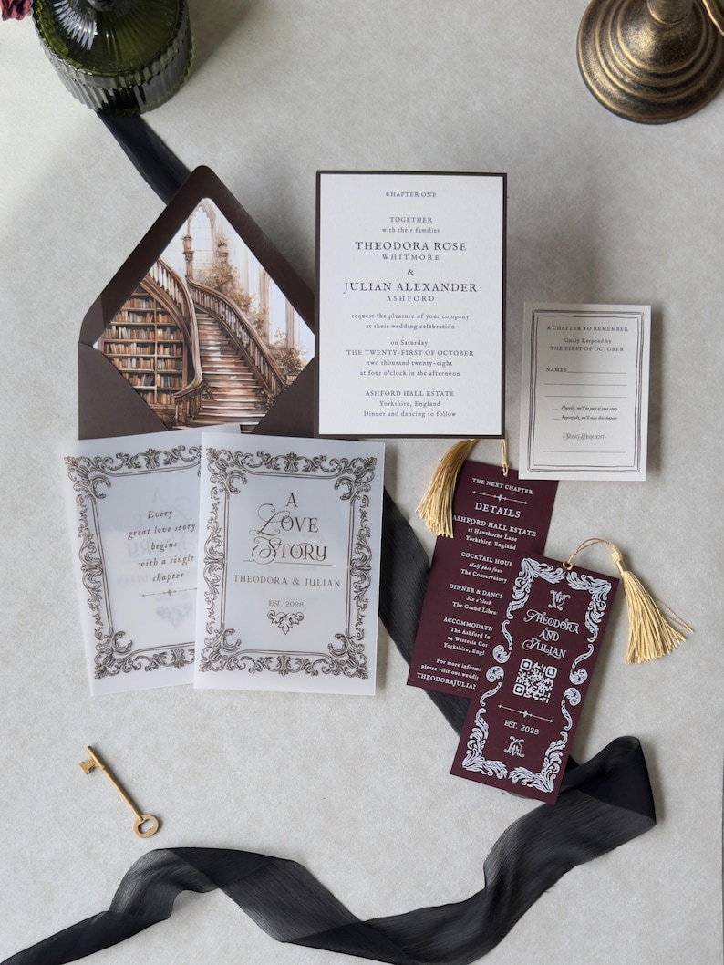 Dark academia wedding stationery displayed with a white invitation featuring elegant typography, antique architectural artwork, vintage-style decorative cards, burgundy bookmark, and dark envelope with an ornate staircase liner.