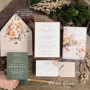 May include: A wedding invitation suite with a floral design. The invitation features a watercolor illustration of peach and white flowers with fall foliage. The invitation text includes the names "Tilli Cove Brightson" and "Porter Jax Shearer" and the date "Saturday, the Ninth of November Two Thousand Twenty Five". The RSVP card features a similar floral design and the text "Kindly Respond by the Tenth of October".