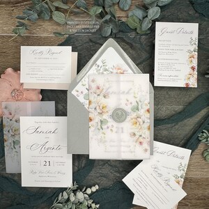 May include: Wedding invitation suite with a floral design. The invitation features a watercolor floral illustration with a peach and cream color scheme. The text on the invitation reads "Together with their families, Samiah and Argento, October 21, Saturday, 4:00 PM, Ridge View Farm & Winery, Appleton, Wisconsin, Dinner and Dancing to Follow".