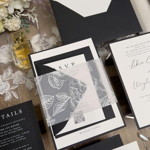 Black and white wedding invitations with classic, timeless design. Minimalist black wedding with white ink floral vellum thick band and monogram wedding logo designed for you.