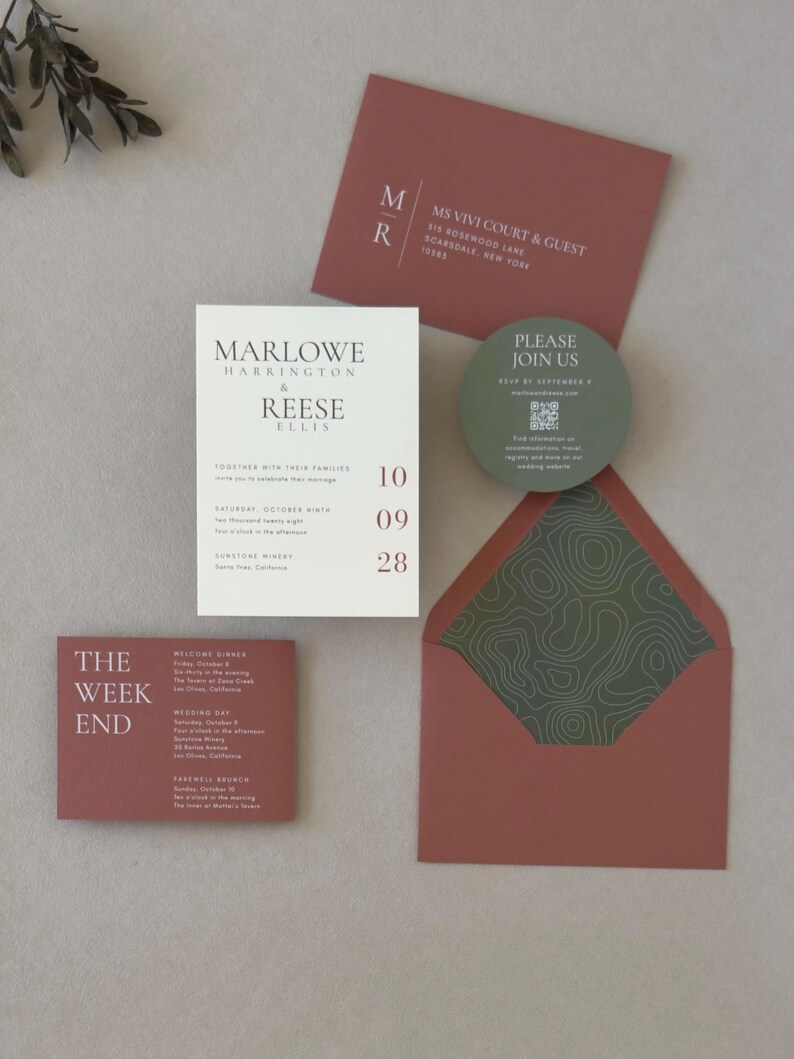 Modern ivory Marlowe wedding invitation styled with clay and olive green stationery, featuring contemporary typography and an earthy wedding color palette.