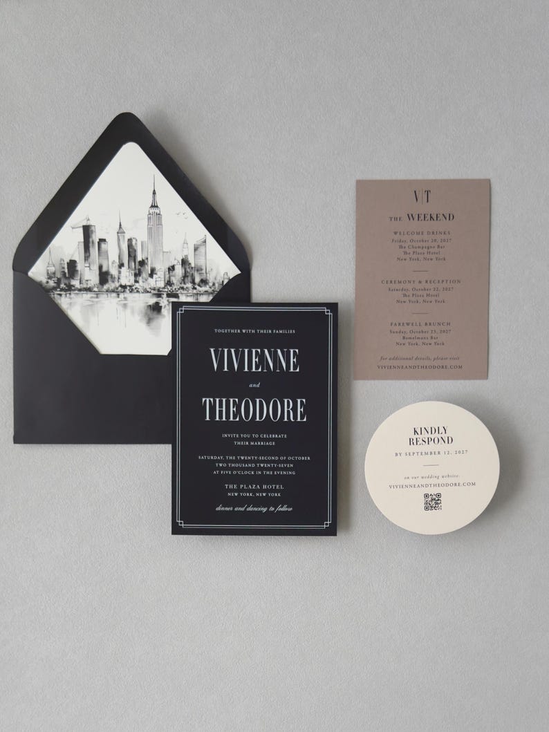 Black, taupe and ivory Vivienne wedding invitation suite featuring a black invitation with elegant typography, taupe details card, round ivory RSVP card and black envelope with a city skyline liner.