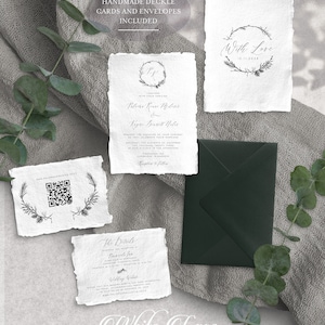 May include: Handmade wedding invitation suite with a rustic, woodland theme. The invitation features a wreath with the couple's initials and the date of the wedding. The details card includes information about the ceremony and reception. The save the date card features a wreath with the text "With Love" and the date. The cards are printed on textured paper with a deckled edge.