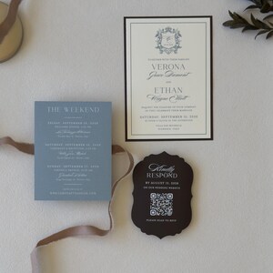 Dusty blue wedding details card with ivory invitation, brown RSVP card