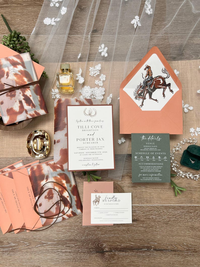 May include: Wedding invitation suite with a rustic theme. Includes invitation cards, RSVP cards, and envelopes in shades of peach, brown, and green. Features a cowboy and horse illustration.