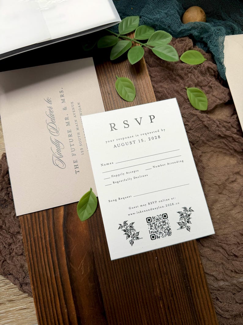 May include: Wedding RSVP cards with the text "RSVP" and "your response is requested by AUGUST 15, 2028". The cards are white with black text and floral illustrations. A second card reads "Kindly Deliver to: THE FUTURE MR. & MRS."