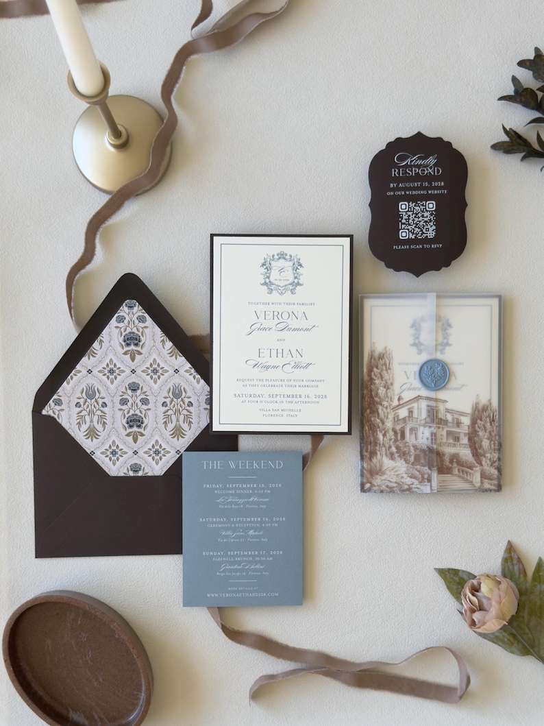 Dusty blue Verona wedding invitation suite with European villa artwork, vellum wrap and brown envelope