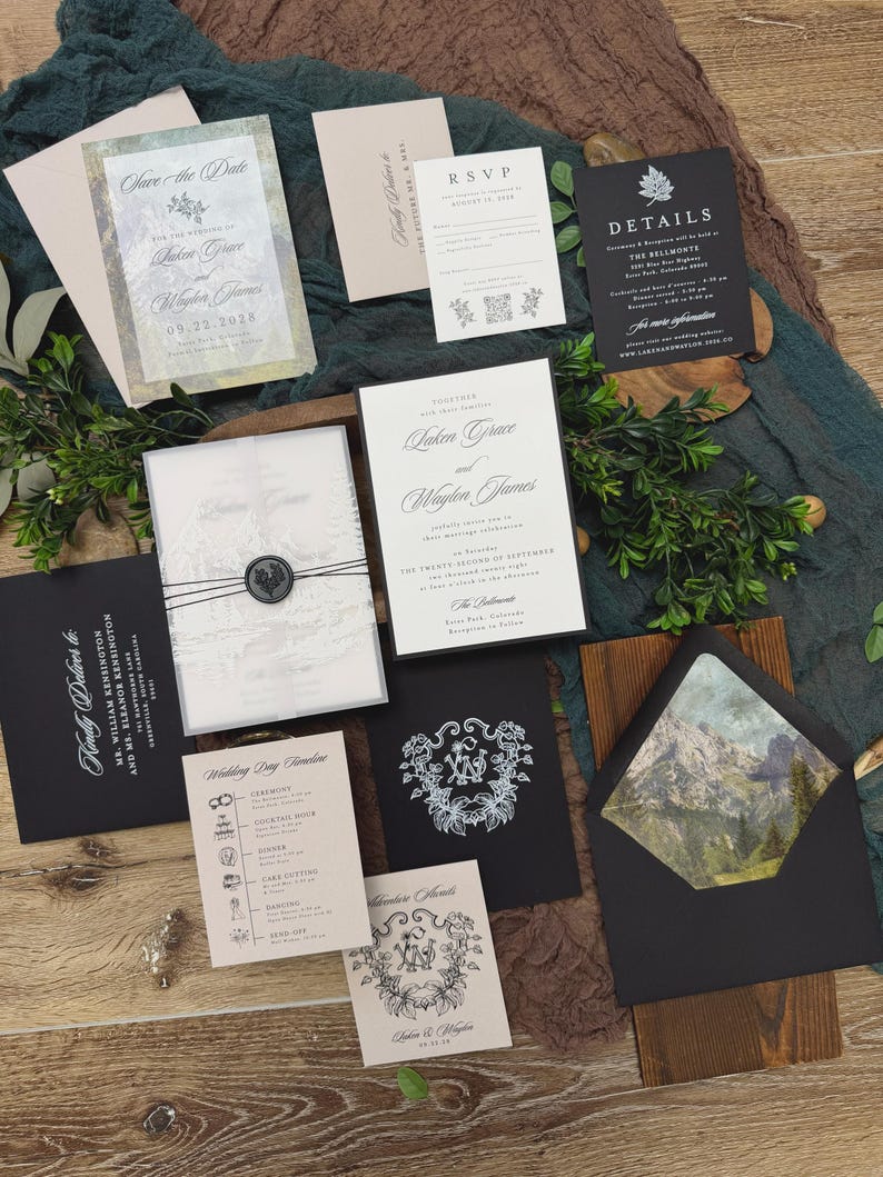 May include: An assortment of wedding stationery, including invitations, RSVP cards, and details cards. The designs feature elegant fonts, floral accents, and a mountain landscape. The color palette includes black, white, and neutral tones.