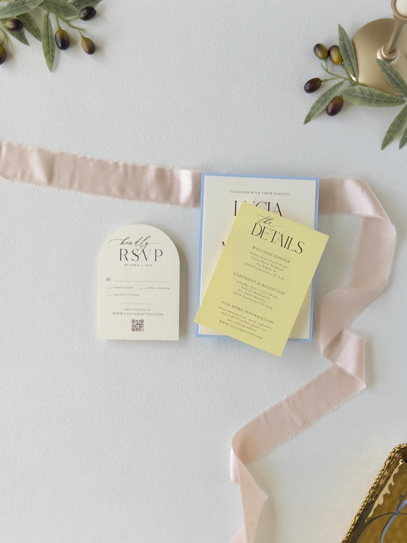 Ivory arch RSVP card and butter yellow wedding details card styled with blush ribbon from the romantic pastel Lucia wedding invitation suite.