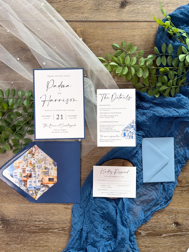 May include: Wedding invitation suite with a blue and white color scheme. The invitation features the names "Padma and Harrison" in cursive script. The details card includes information about the reception, the venue, and accommodations. The RSVP card has a blue background and white text.
