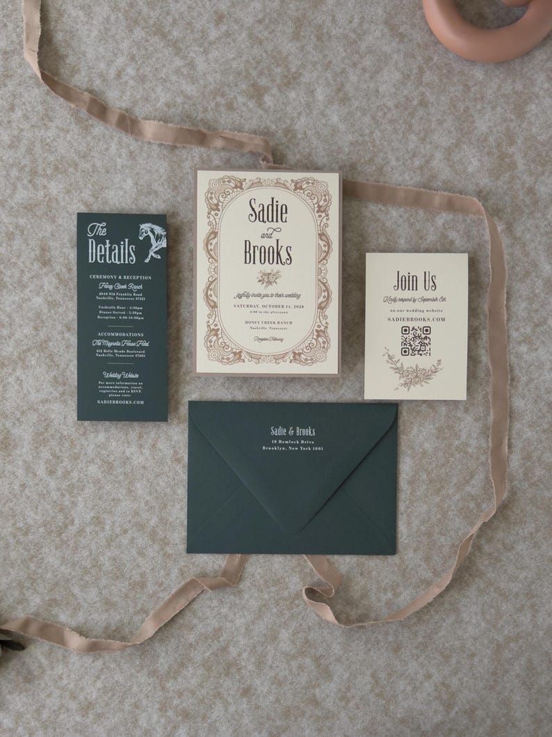 Dark green and ivory Sadie wedding stationery suite featuring an ornate bordered invitation, QR code RSVP card and coordinating envelope styled with taupe ribbon.