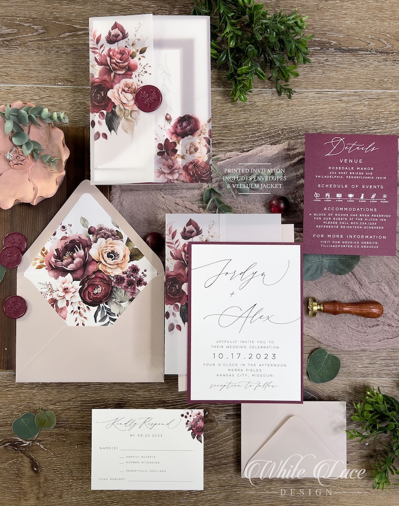 Burgundy and dusty rose floral wedding invitation suite with romantic botanical artwork and coordinating stationery.