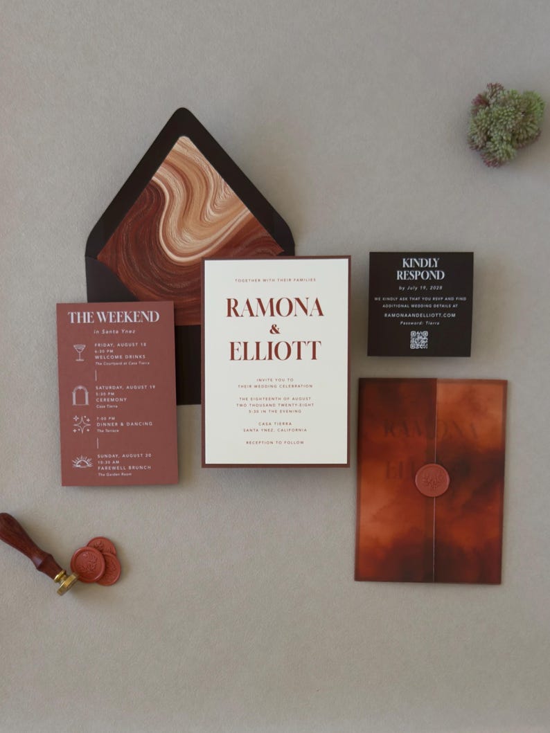 Dark brown wedding envelope with bold abstract liner in rust, terracotta and cream, displayed with the layered Ramona wedding invitation and coordinating RSVP card
