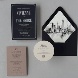 Vivienne black wedding invitation suite shown in an assembly video featuring modern black stationery, taupe details card, circular RSVP card and architectural city details.
