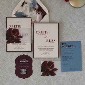Romantic burgundy floral wedding invitation suite with dusty blue details card, ivory invitation, scalloped burgundy RSVP and burgundy envelope with dramatic coordinating floral liner.