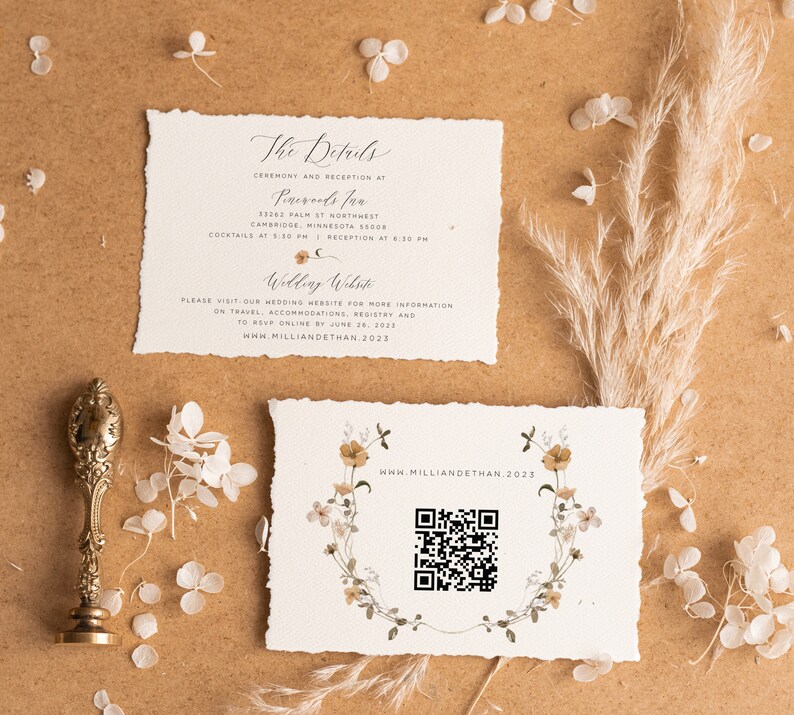 May include: A wedding invitation with a rustic, floral design. The invitation includes the details of the ceremony and reception, as well as a QR code to access the wedding website. The text on the invitation reads "The Details", "Ceremony and Reception at", "Perevals Inn", "13263 Palm St Northwest", "Cambridge, Minnesota 55008", "Cocktails at 5:30 PM", "Reception at 6:30 PM", "Wedding Website", "Please visit our wedding website for more information on travel, accommodations, registry and to RSVP online by June 26, 2023", "www.milliandethan.2023", and "www.milliandethan.2023".
