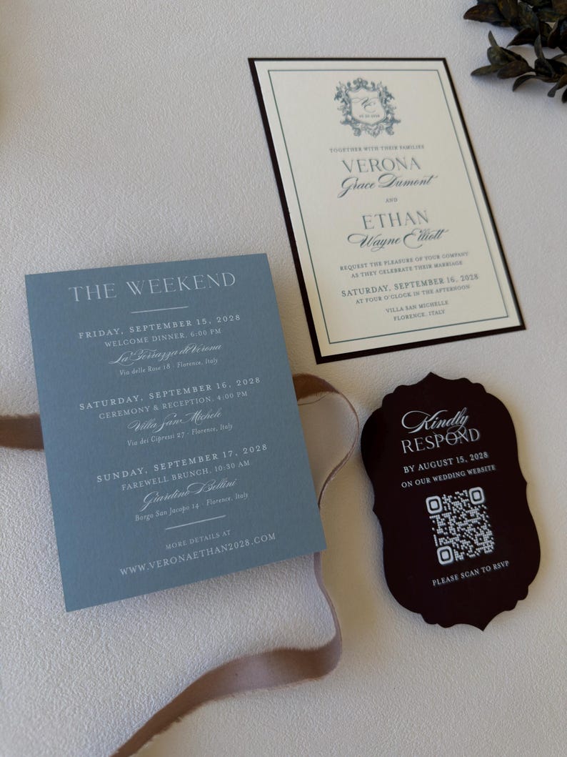 Close-up of dusty blue Verona details card with ivory wedding invitation