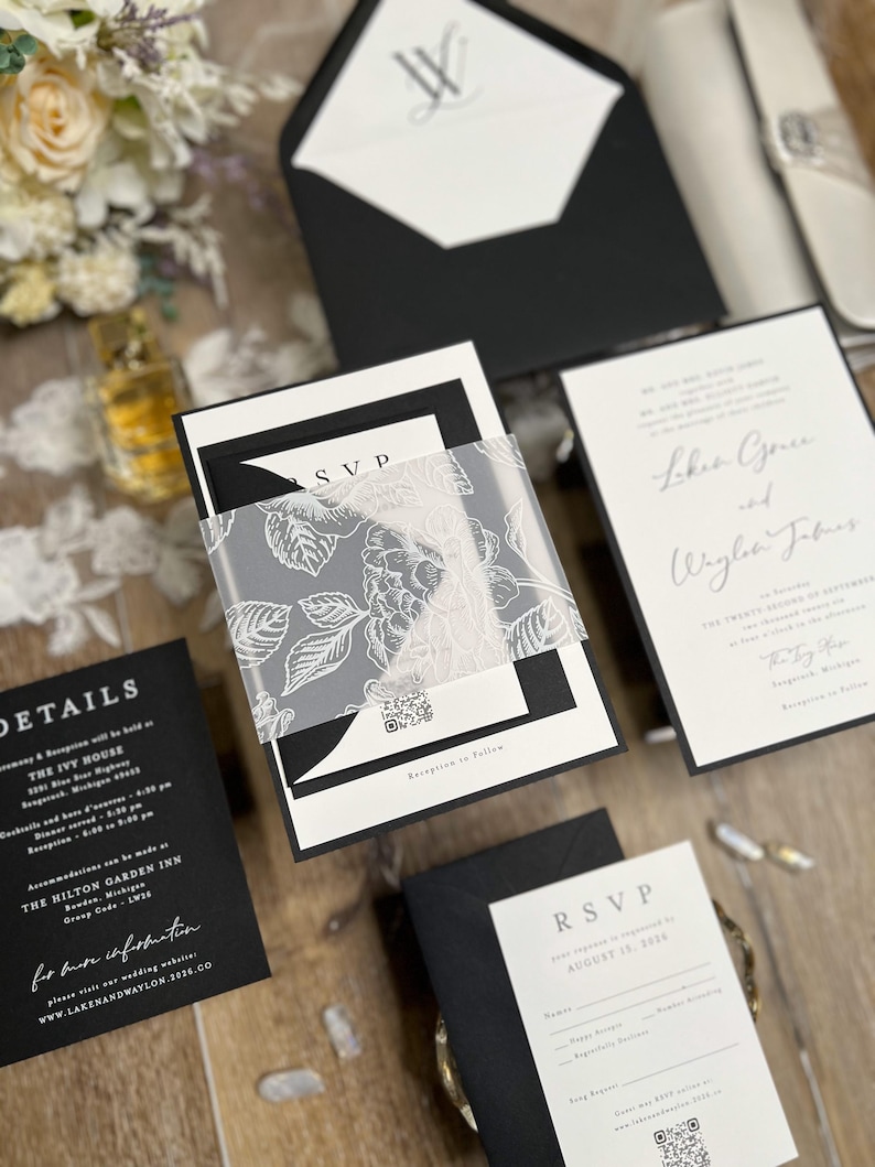 Black and white wedding invitations with classic, timeless design. Minimalist black wedding with white ink floral vellum thick band and monogram wedding logo designed for you.