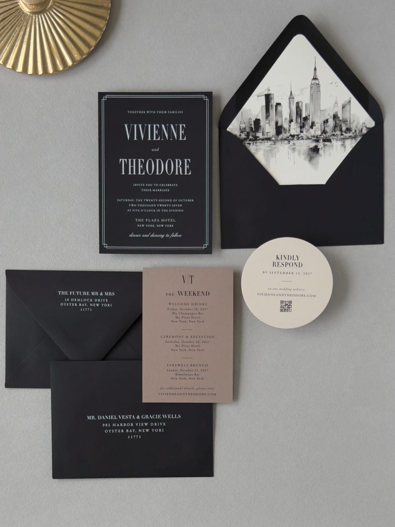 Black, taupe and ivory wedding stationery featuring an elegant invitation, rectangular details card, circular RSVP card and architectural skyline envelope liner.