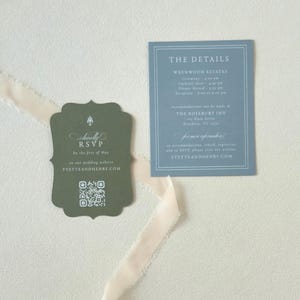 Dark green scalloped RSVP card with QR code paired with a dusty blue wedding details card from the romantic Yvette wedding invitation suite.