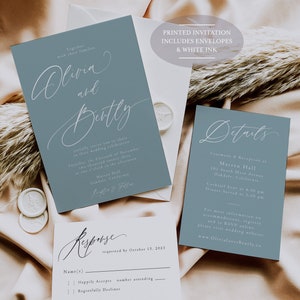 May include: Wedding invitation suite featuring a dusty blue color scheme. Includes invitation, details, and response cards with elegant script. The text "Olivia and Bently" is prominently displayed. The suite includes envelopes and white ink.
