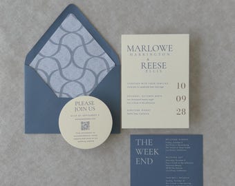May include: A wedding invitation suite featuring a slate blue envelope with a grey geometric patterned liner, a cream rectangular invitation card, a circular cream RSVP card with a QR code, and a rectangular slate blue weekend itinerary card.