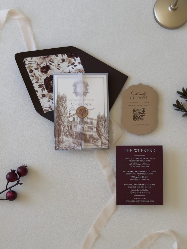 European villa wedding invitation with printed vellum wrap and patterned burgundy envelope liner