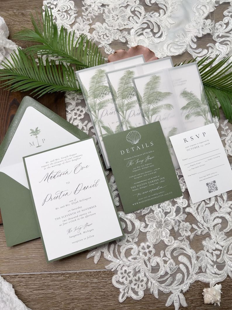 May include: Wedding invitation suite featuring a green and white color scheme. The invitation includes a palm tree graphic and elegant script. The suite includes an RSVP card, details card, and envelope.