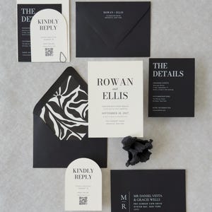Modern black wedding invitation suite featuring bold serif typography, ivory RSVP card and coordinating stationery