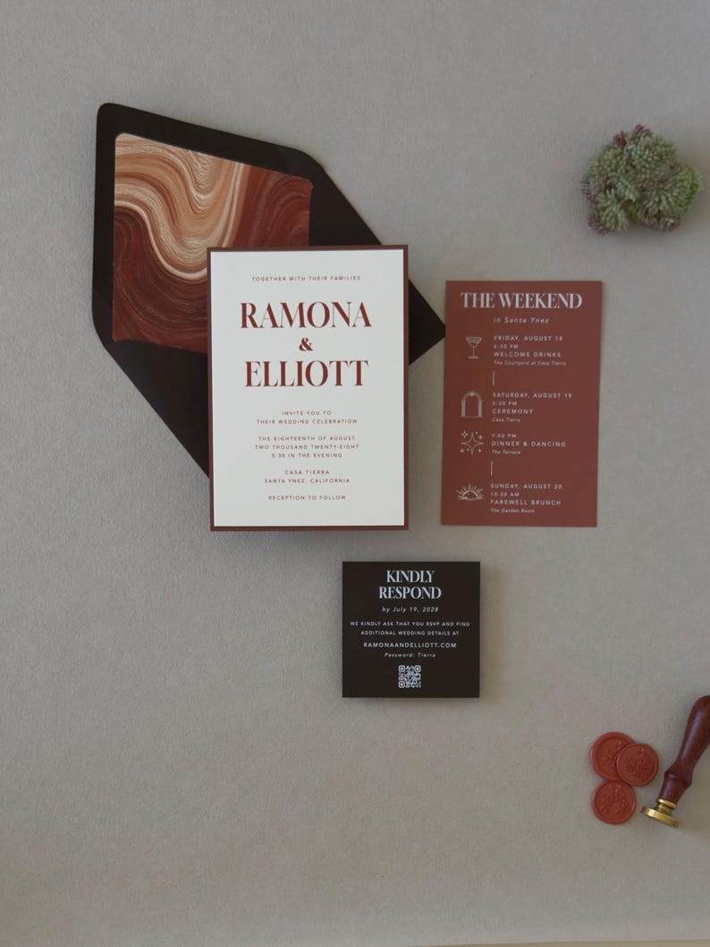 Modern Ramona wedding invitation paired with a rust details card and dark chocolate square RSVP card, styled in warm earthy tones on a neutral background.