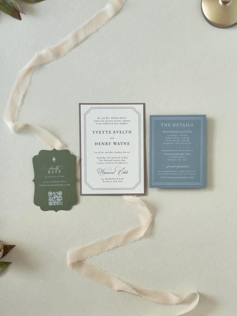Ivory wedding invitation paired with dusty blue details card and dark green scalloped RSVP card, featuring soft landscape artwork for an elegant country wedding.