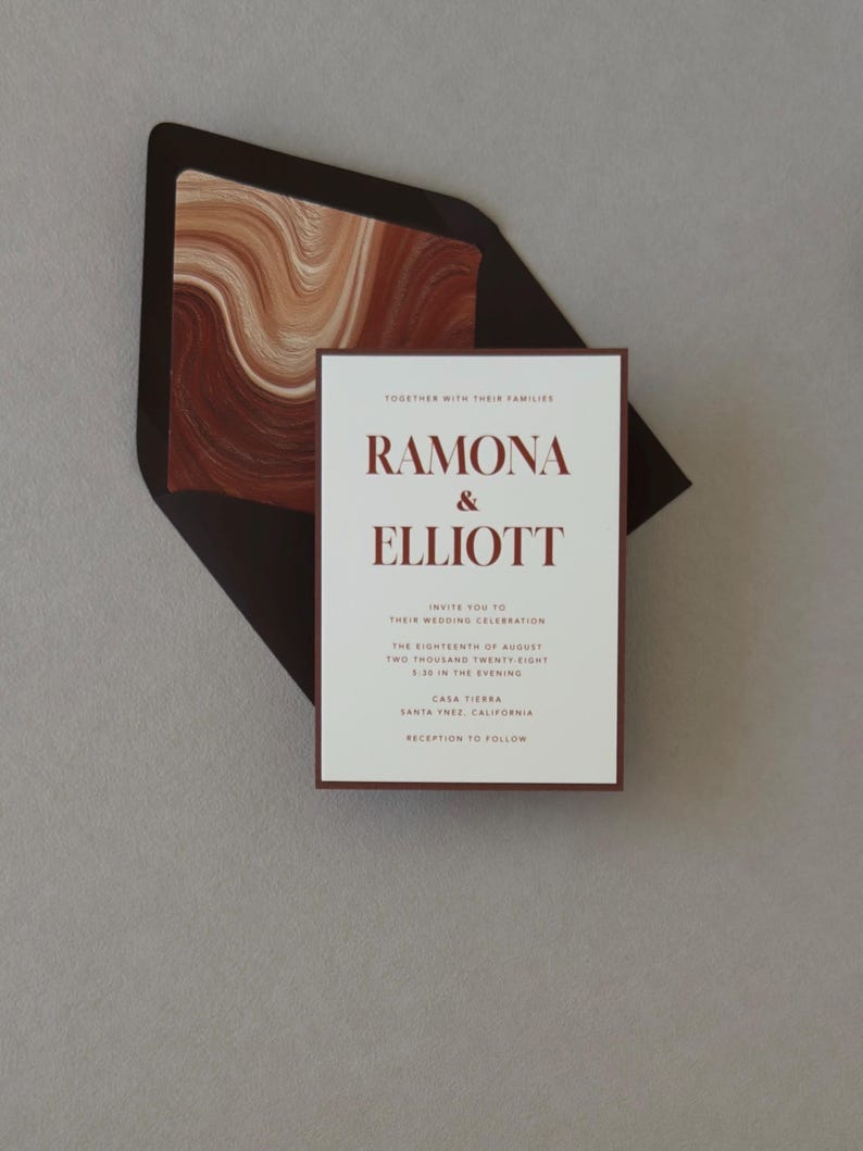 Ramona terracotta and brown wedding invitation suite shown in an assembly video featuring warm ivory stationery, rich rust accents and modern abstract details.