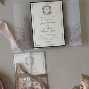 Layered cream wedding invitation with chocolate brown backing mat styled with olive green RSVP card and Italian-inspired vellum wrap.