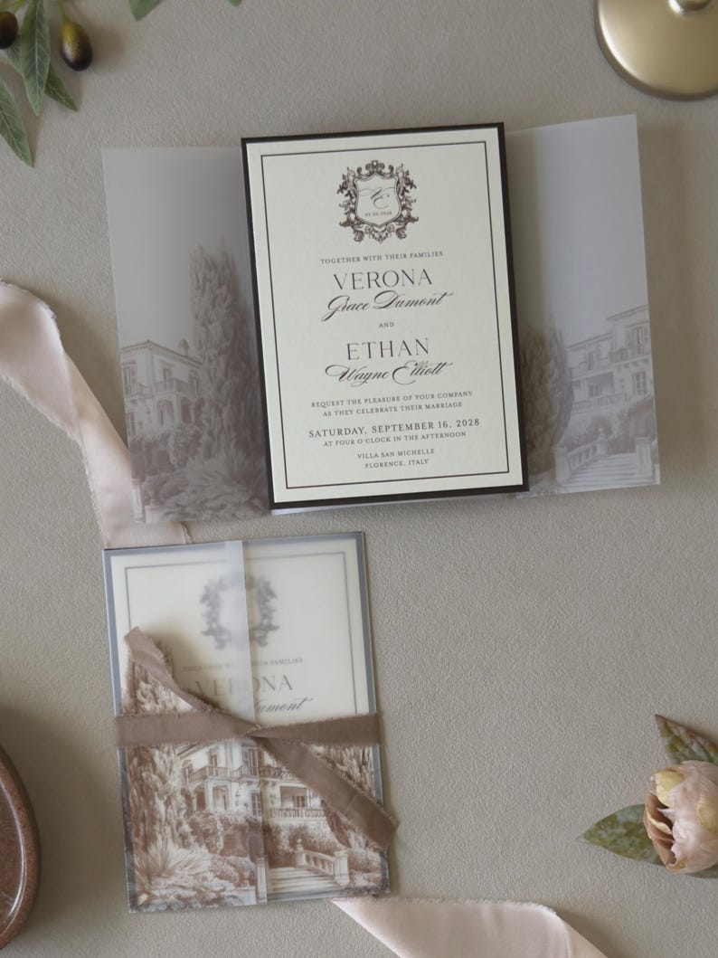 Layered cream wedding invitation with chocolate brown backing mat styled with olive green RSVP card and Italian-inspired vellum wrap.