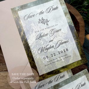 May include: Wedding "Save the Date" cards with a mountain landscape design. The cards feature elegant calligraphy with the names "Laken Grace and Waylon James" and the date "09.22.2028". The text "Save the Date" is also visible.