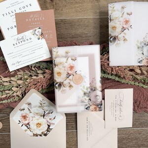 Complete neutral wedding invitation suite with floral envelope liner, RSVP card and coordinating stationery.