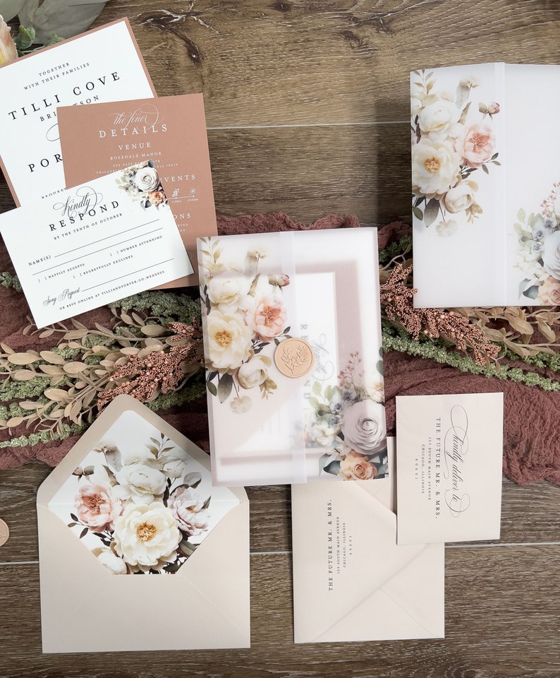 Complete neutral wedding invitation suite with floral envelope liner, RSVP card and coordinating stationery.