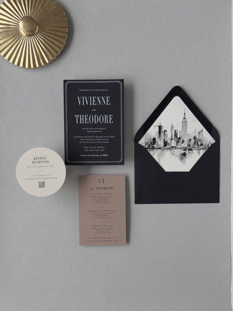 Vivienne black wedding invitation suite shown in an assembly video featuring modern black stationery, taupe details card, circular RSVP card and architectural city details.