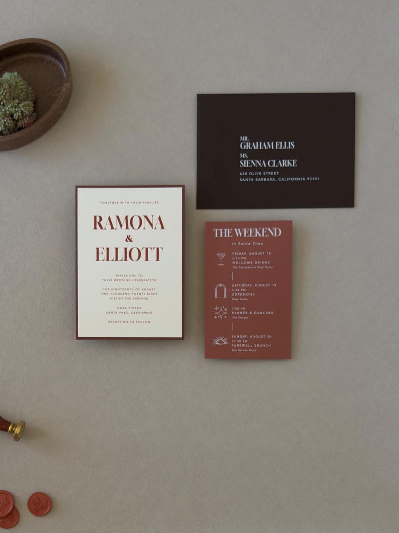 Warm ivory Ramona wedding invitation paired with terracotta details card and dark chocolate RSVP card for a modern earthy fall wedding color palette.