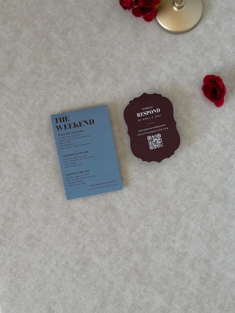 Coordinating wedding invitation cards in dusty blue, burgundy and ivory, showing the details card, scalloped RSVP and floral invitation from a romantic burgundy and blue wedding stationery suite.