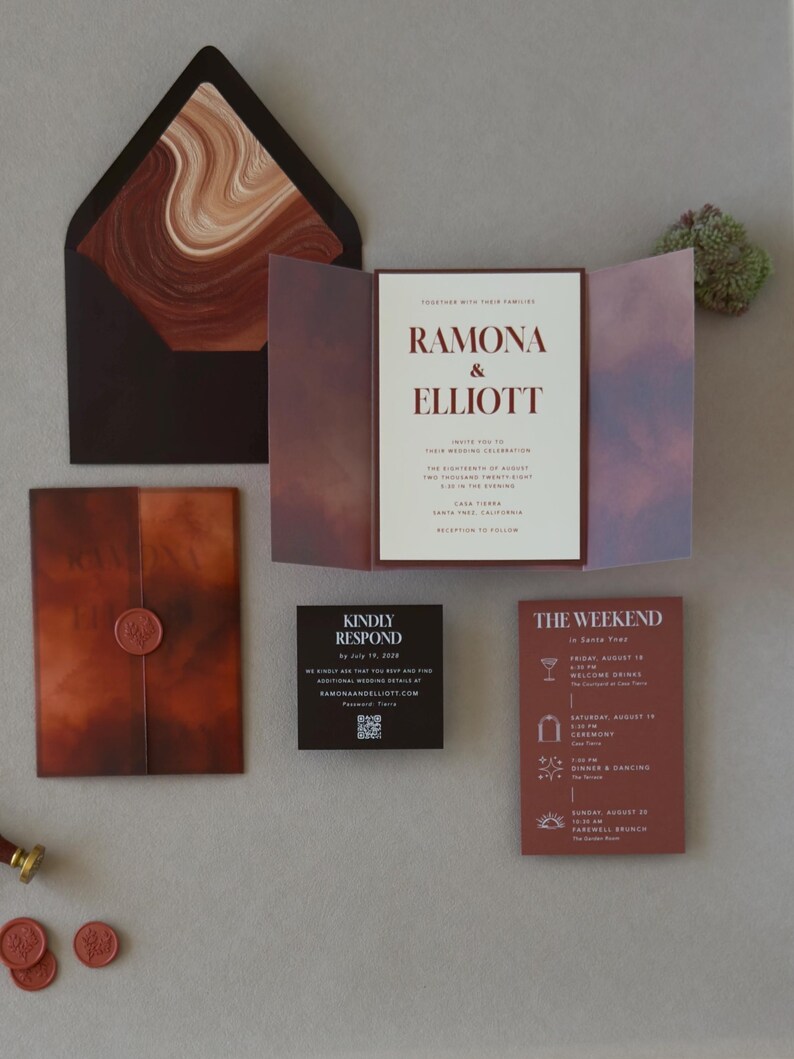 Rust, brown and ivory wedding stationery featuring a layered invitation, terracotta details card, square RSVP card and artistic abstract envelope liner.
