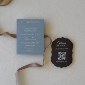 Dusty blue wedding details card with brown RSVP card
