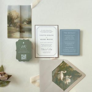 Ivory, dusty blue and dark green wedding invitation suite featuring vintage-inspired typography, scalloped RSVP card, scenic vellum artwork and elegant countryside details.