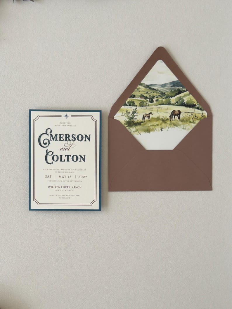 Western wedding invitation paired with translucent layered stationery tied with thin brown ribbon, featuring dusty blue and warm neutral details for an elegant ranch wedding.