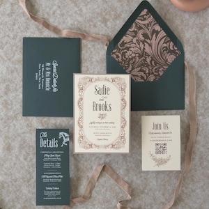 Dark green and warm ivory Sadie wedding invitation suite featuring a vintage-inspired bordered invitation, green details card, QR code RSVP card and coordinating dark green envelope with floral liner.