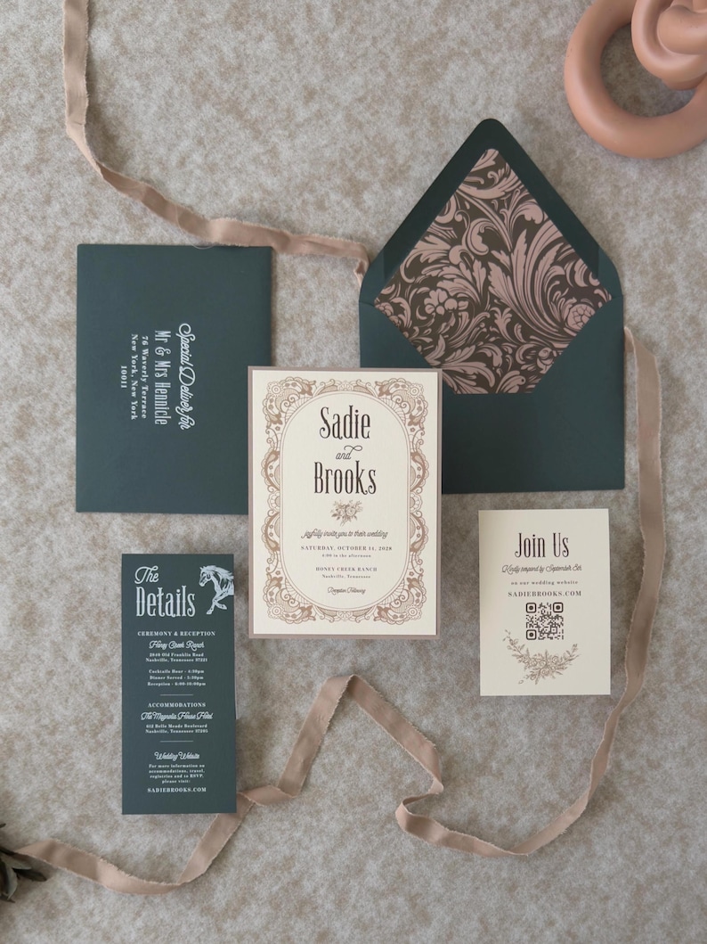 Dark green and warm ivory Sadie wedding invitation suite featuring a vintage-inspired bordered invitation, green details card, QR code RSVP card and coordinating dark green envelope with floral liner.