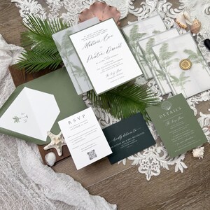 May include: Wedding invitation suite featuring a main invitation with names and event details, RSVP card, details card, and envelopes. The design includes palm tree illustrations and a wax seal. Colors include white, green, and dark green.