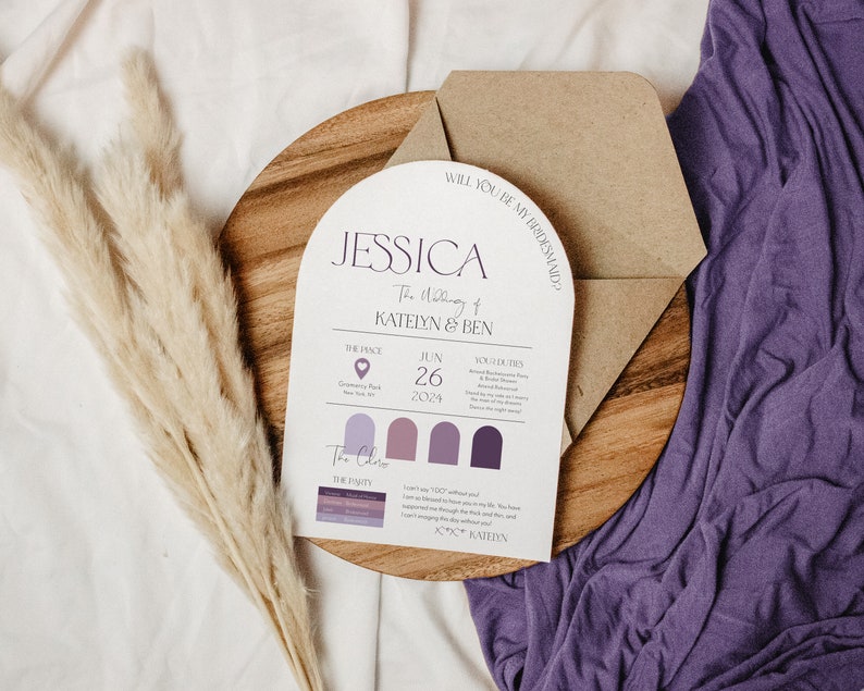 May include: A wedding invitation card with a purple and white color scheme. The card features a modern arch design with the text "Jessica The Wedding of Katelyn & Ben" and the date "June 26, 2024".