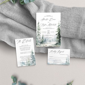 May include: A wedding invitation suite with a winter forest theme. The main invitation features a watercolour illustration of a snowy forest with pine trees. The text reads "Together with their families Abrelle Dove and Taylor Mitchell invite you to their wedding celebration Saturday, January 21, 2024 at 4:30 PM Parkwood Inn Springfield, Missouri Reception to follow". The details card includes information about the ceremony and reception at The Parkwood Inn. The RSVP card features a similar watercolour illustration and asks guests to RSVP by 20 December 2023.