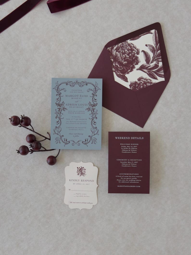 Burgundy A7 wedding invitation envelope opened to reveal a colorful vintage botanical floral envelope liner